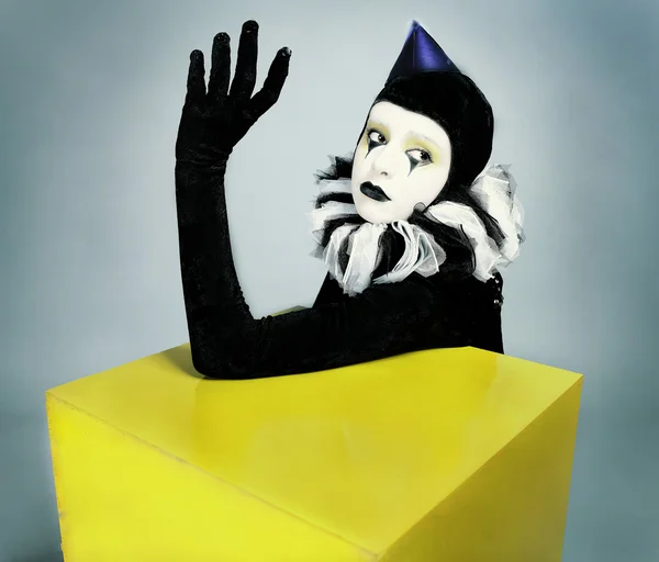 Сircus fashion mime posing near a yellow square — Stock Photo, Image