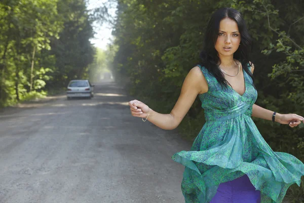 Girl in the road on summer dres. — Stock Photo, Image