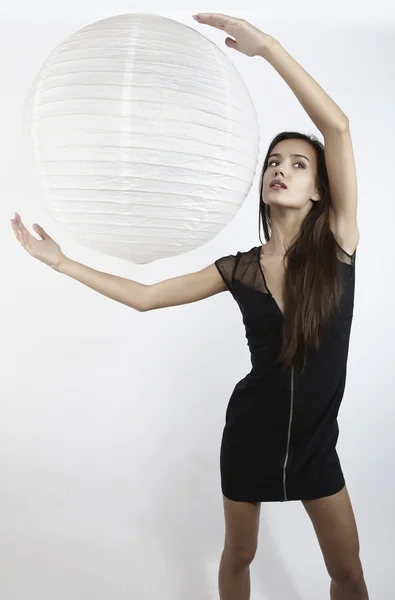 Beautiful brunette with paper ball — Stock Photo, Image