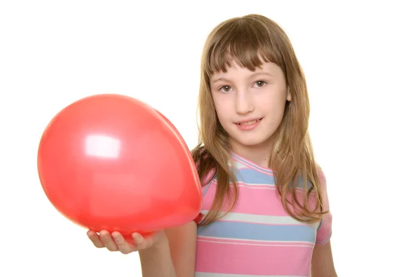 Girl holds red balloon on hand — Stock Photo, Image