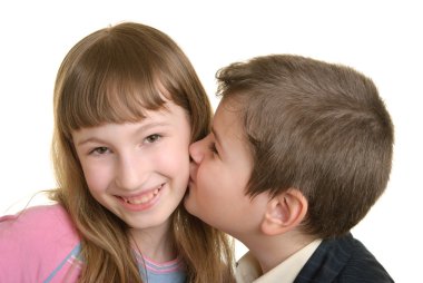 Boy kisses the girl on cheek clipart