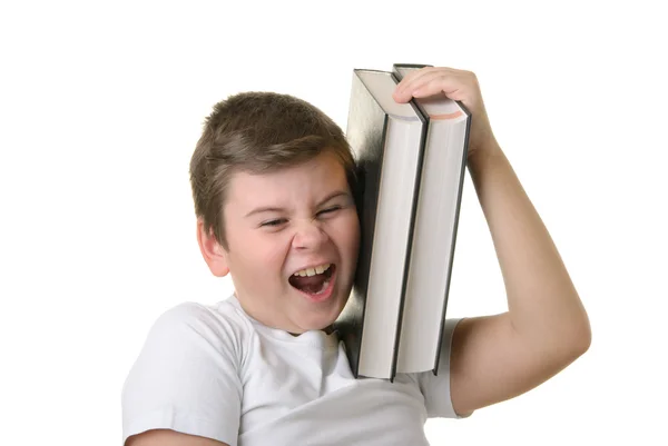 Happy boy holds some books and smiles — Stock Photo, Image