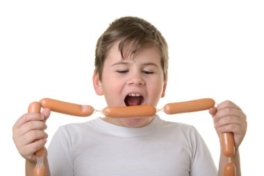 Boy with appetite bites sausages clipart