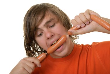 Teenager with appetite bites sausages clipart