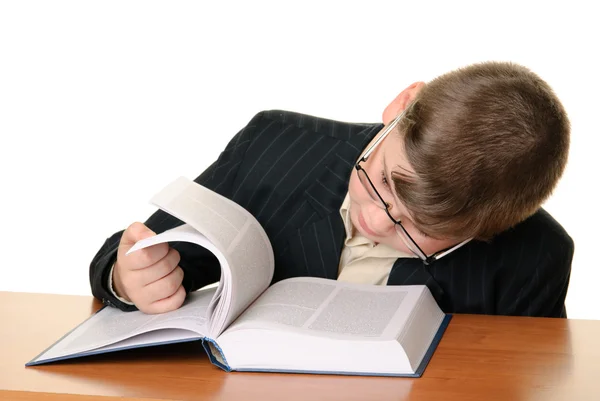 Boy with points reads book — Stock Photo, Image