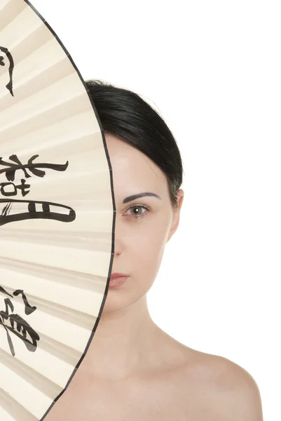 Young woman covered with fan — Stock Photo, Image