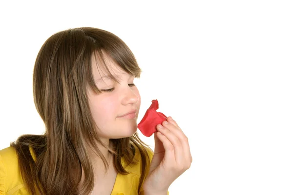 Girl holds petal of flower and smells — Stock Photo, Image