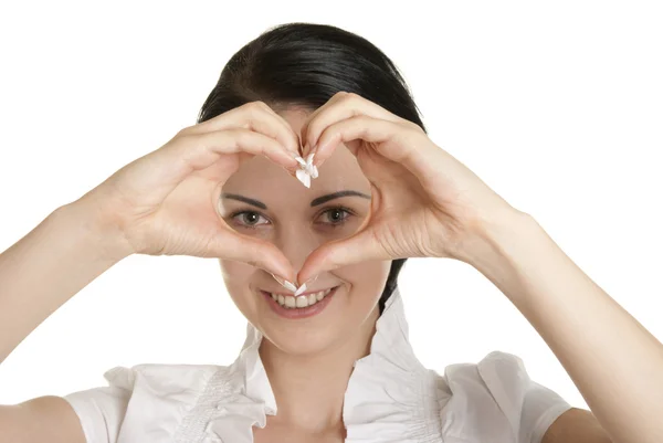 Young woman shows fingers heart symbol — Stock Photo, Image