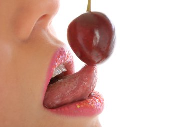 Woman with make-up licks cherry clipart