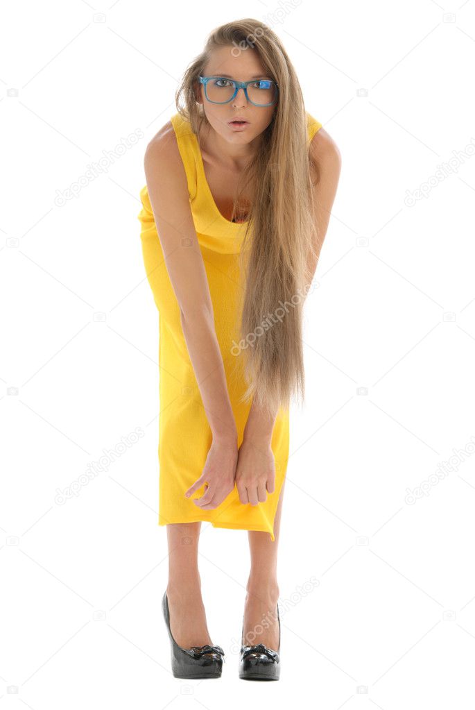 Young woman in yellow dress and with glasses