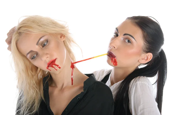 Woman sucks blood from neck of other woman — Stock Photo, Image