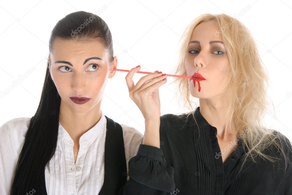 Woman sucks blood from an ear other woman