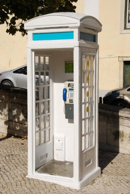 White portuguese telephone booth in Lisbon clipart