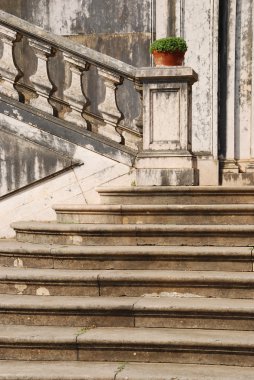 Architectural detail of a antique staircase with stone steps clipart