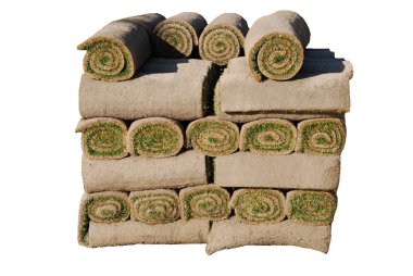 Rolls of sod isolated on white background clipart