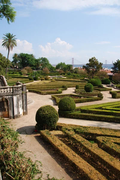 Enchanted Ajuda garden with April 25th bridge in Lisbon, Portugal — Stock Photo, Image