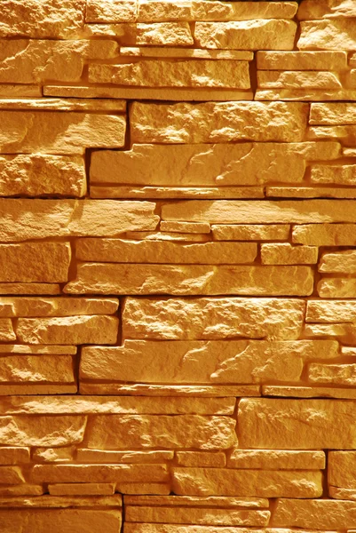 Unshaped stone wall (illuminated) — Stock Photo, Image