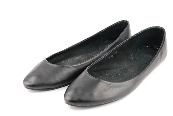 Dame schwarzes Leder Ballett flache Schuhe auf weiß — Stockfoto