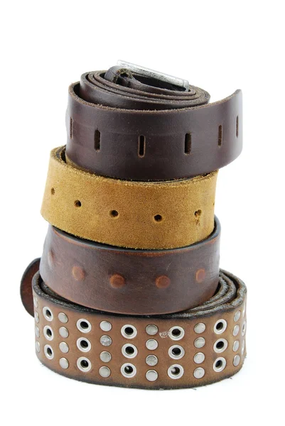 Stack pile of leather belts on white — Stock Photo, Image