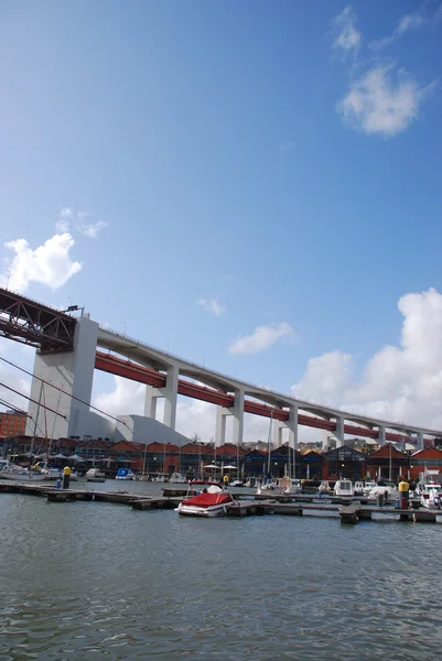 Lisbon's docks under April 25th bridge — Stock Photo, Image