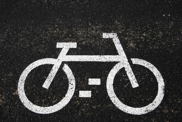 Asfalto con signo de bicicleta —  Fotos de Stock