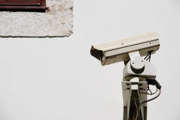 Security camera by the window — Stock Photo, Image