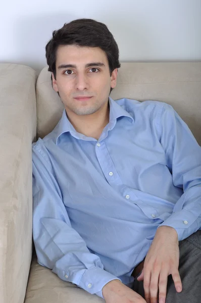 Man relaxing on the couch Stock Picture