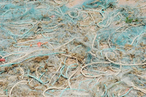 Oude visnetten in de haven van cascais, portugal — Stockfoto