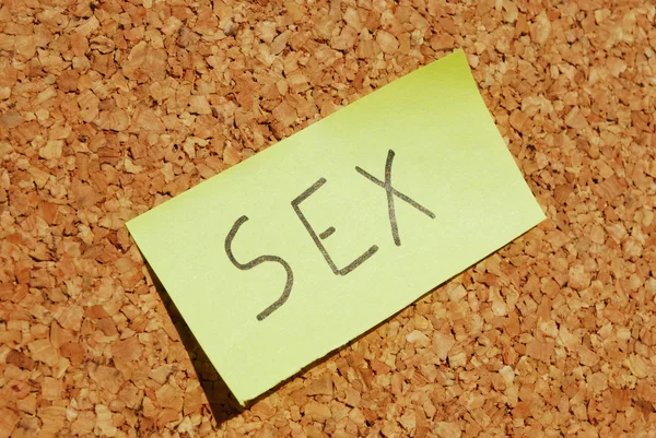 Parola chiave del sesso su una tavola da sughero — Foto Stock
