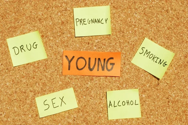 Young concerns on a cork board — Stock Photo, Image