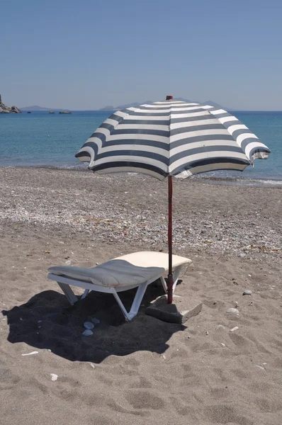 Beach umbrella and chair — Stock Photo, Image
