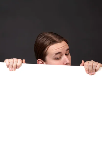 Teenager holding blank sign — Stock Photo, Image