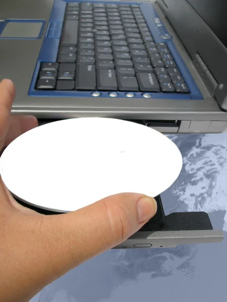 Cd with blank label in laptop computer — Stock Photo, Image