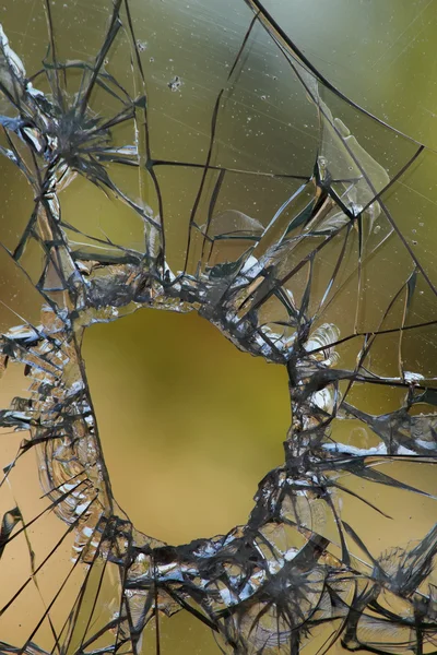 Hole glass cracks — Stock Photo, Image