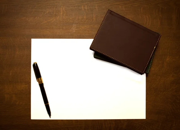 Books, pen and white paper — Stockfoto