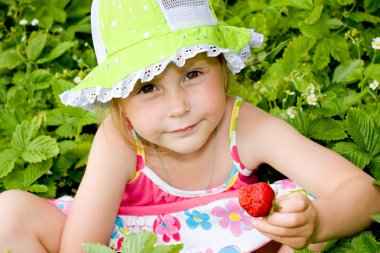 Girl eating strawberries clipart