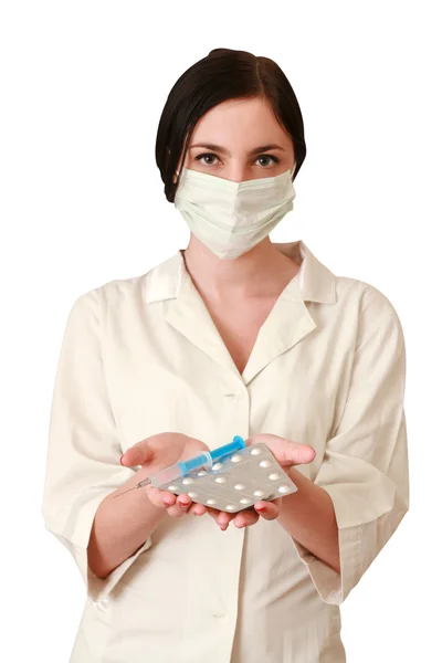 Woman doctor with pills and syringe — Stock Photo, Image