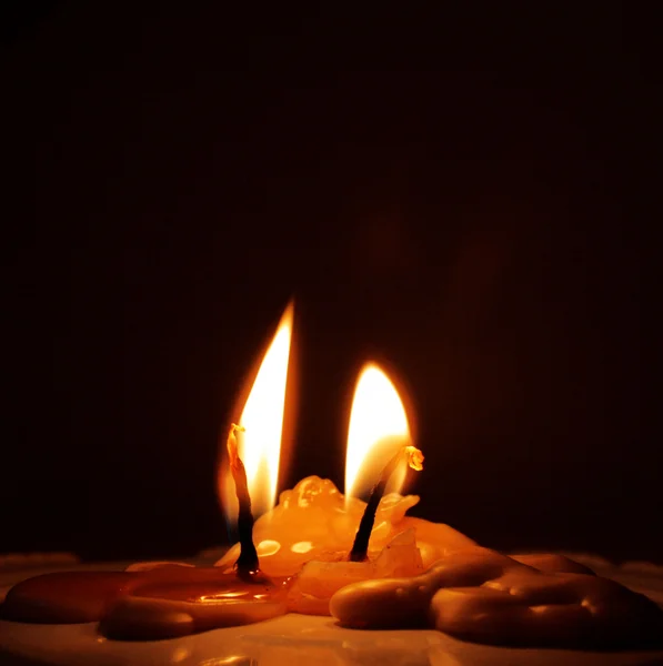 Two burnt candles still burning — Stock Photo, Image