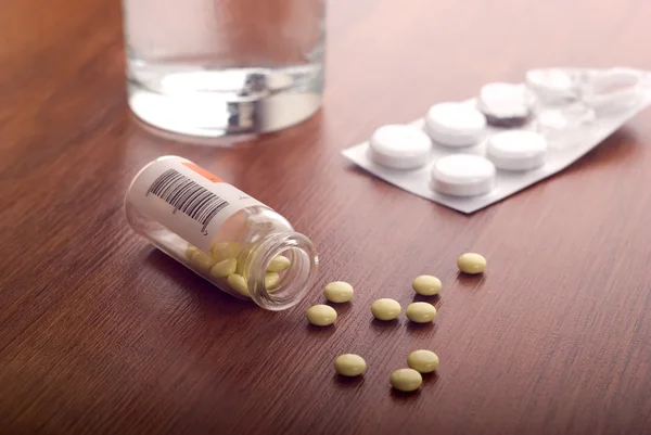 Opened bottle of pills — Stock Photo, Image