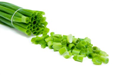 Cut green onion isolated on the white background clipart