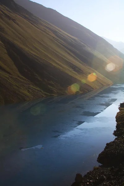 stock image Mountain lake in background with high mountain