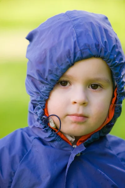 Boy in a raincoat — Stock Photo, Image