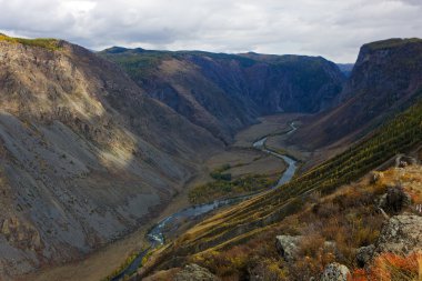 River in a valley clipart