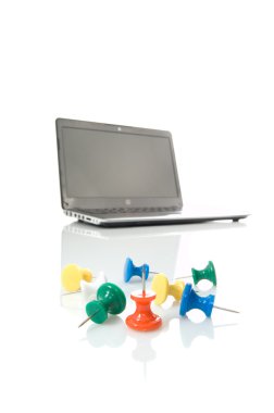 Several thumbtacks and laptop clipart