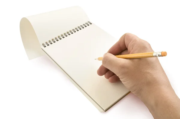 Lápis na mão, escrito em um caderno — Fotografia de Stock