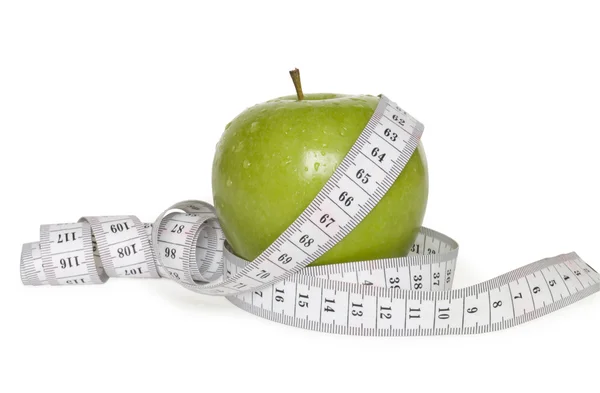 Zielone jabłko i centymetrem — Zdjęcie stockowe
