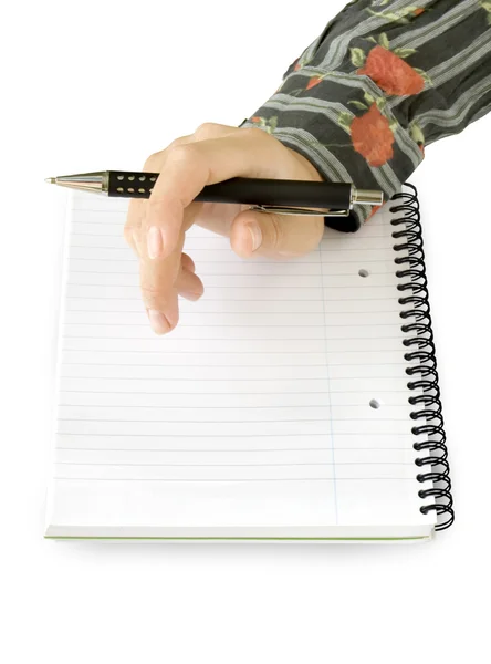 Mão com caneta no caderno — Fotografia de Stock