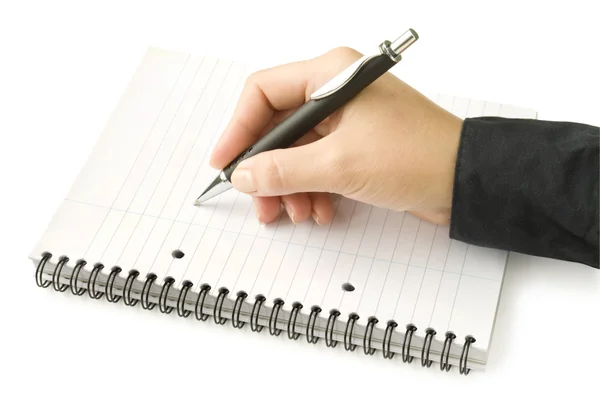 Mão com caneta escrita no caderno — Fotografia de Stock