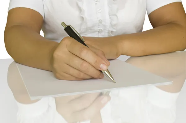 Ręka z pióra pisanie na notebooka — Zdjęcie stockowe
