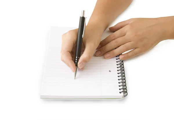 Hand mit Stift auf dem Notizbuch — Stockfoto